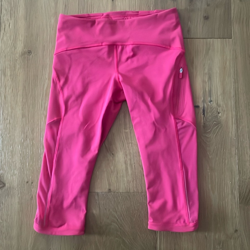 Lululemon Size 6 Bright Pink/Coral color knee length legging, zipper pocket